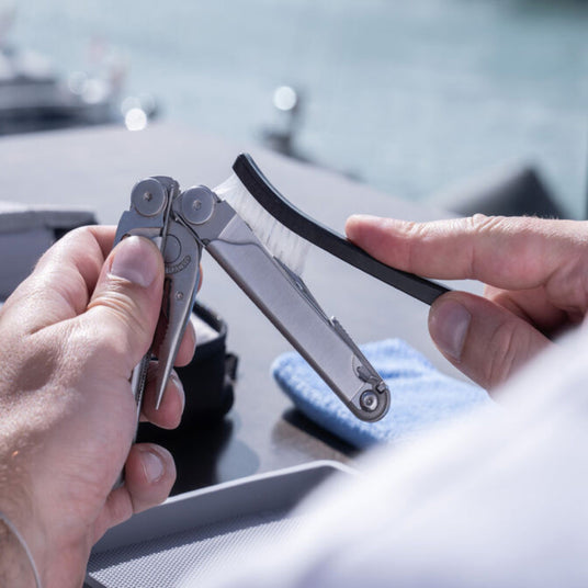 Translation missing: en.Man using a brush to clean a Wave Plus