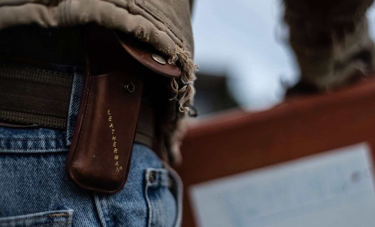 Translation missing: en.Man with brown jacket wearing Leatherman Heritage Sheath on belt