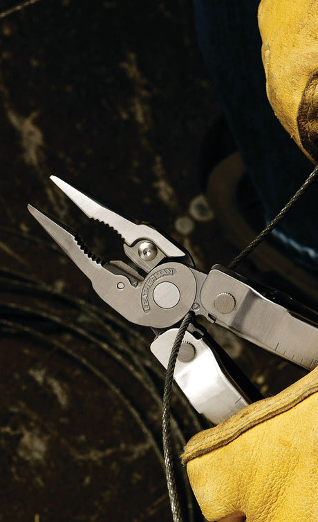 Translation missing: en.A Leatherman being used to cut a wire