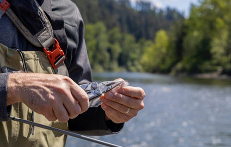 Leatherman plier-based multitool being used on fishing gear