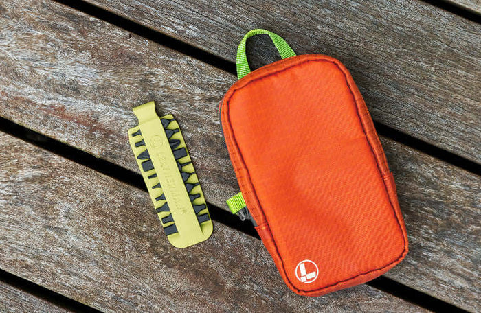 Translation missing: en.Leatherman Aurora tool pouch with a Mojito bit kit on wooden surface