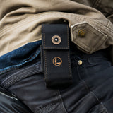 Translation missing: en.A man wearing a Leatherman Black Bronze Nylon Sheath positioned on his back, ready for carrying a Leatherman tool