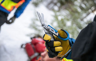 Translation missing: en.In a snowy landscape, an individual grips a pair of Leatherman Raptor Shears, ready for a task or project