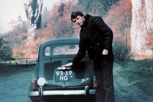 Tim Leatherman next to the fiat he toured Europe in