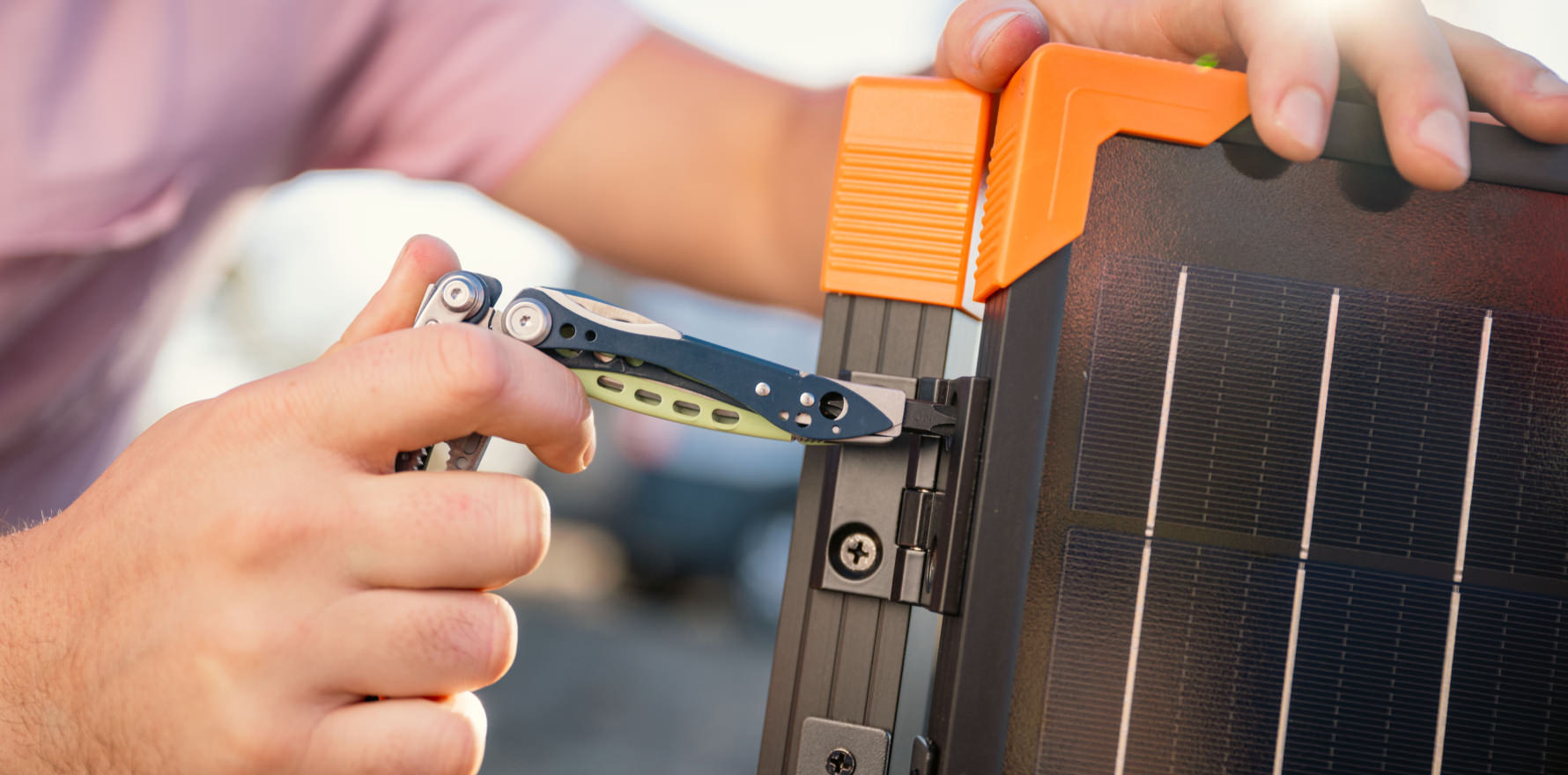 Skeletool CX screw driver bit being used on camping table