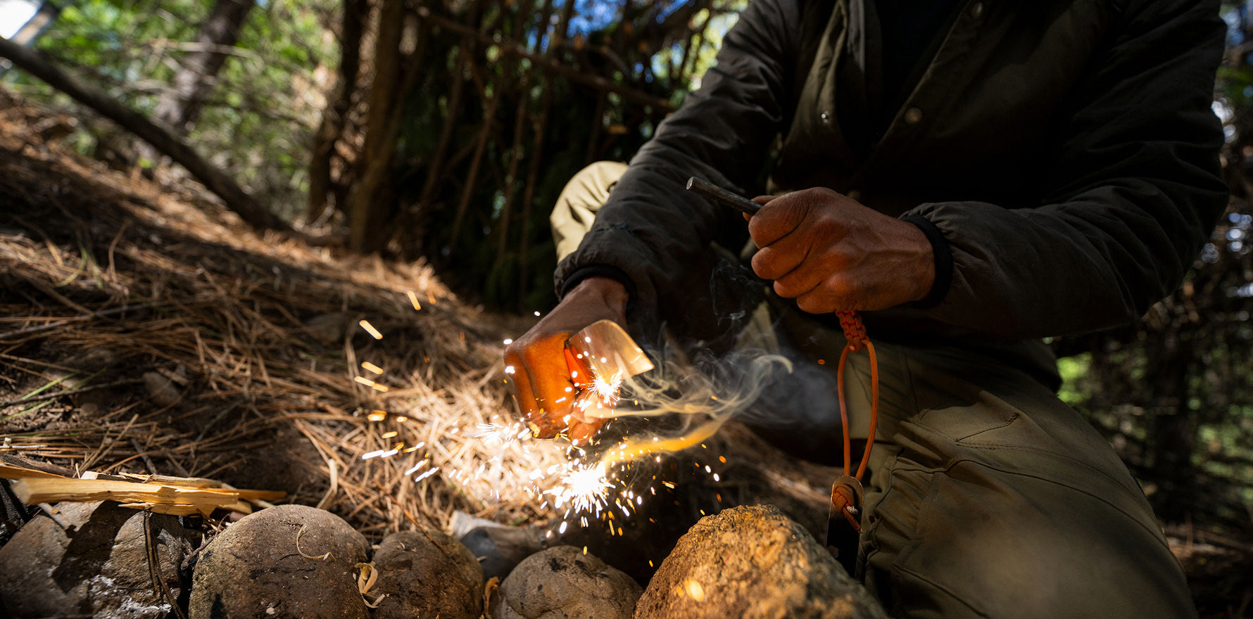 A man uses a Leatherman Pioneer to start fire, highlighting a rustic approach to meal preparation.