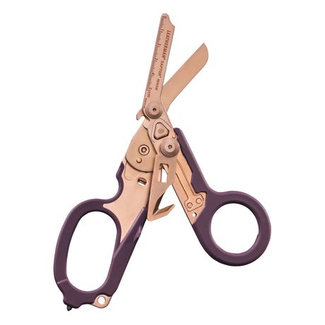Translation missing: en.Raptor® Rescue shears in Rose Gold with purple handles, shown open to display blades and integrated tools