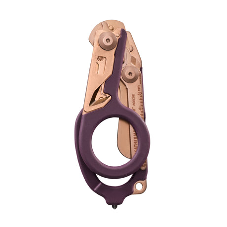 Translation missing: en.Folded Raptor® Rescue tool in Rose Gold with purple handles and visible measurement markings on the shears