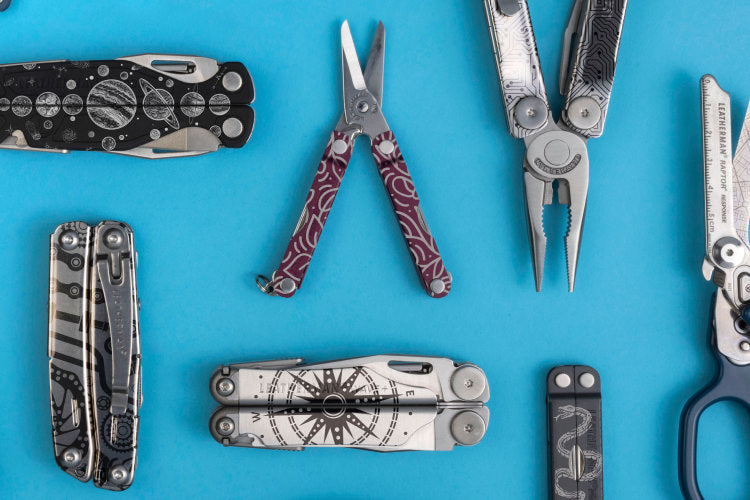 Translation missing: en.An assortment of customized Leatherman tools on a blue background